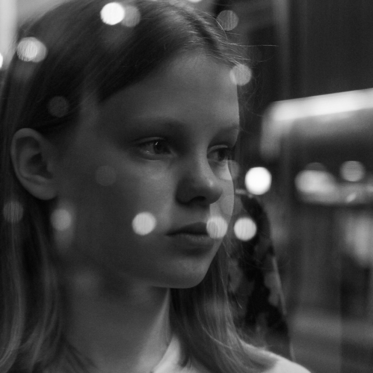 Martina Büttner: Reflection portrait in tramway, Berlin